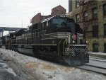 NS 1066 rolls slowly by as 284's crew makes their pick up in the yard